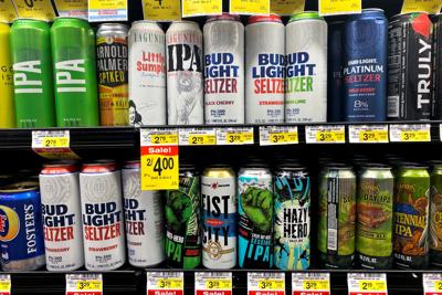 Cans of AB InBev's Bud Light hard seltzer are displayed in a fridge in Jewel-Osco supermarket in Chicago