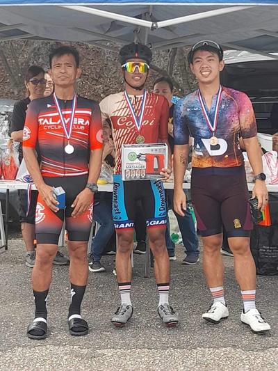 Renren Gaviola, center, Joel Buco, left, and Arvin Velasco are the top three bikers in the long course of the Race for a Cause 2023 in Marpi.