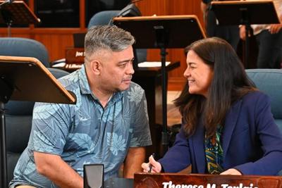Sen. Chris Barnett and Speaker Therese Terlaje talk together during a recess for discussions on Bill 65-37 at a session held July 24, 2023.