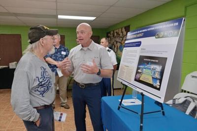 Attendees learn about the Enhanced Air and Missile Defense system during a Missile Defense Agency open house public scoping meeting at the Hågat Community Center on Friday. U.S. Army Soldiers supporting the system may be housed at the Guam National Guar...